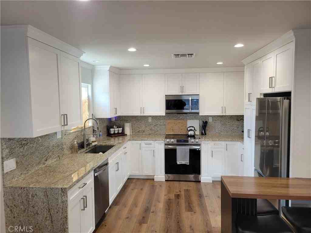 7702 Mason Ave - Photo 2 of 11