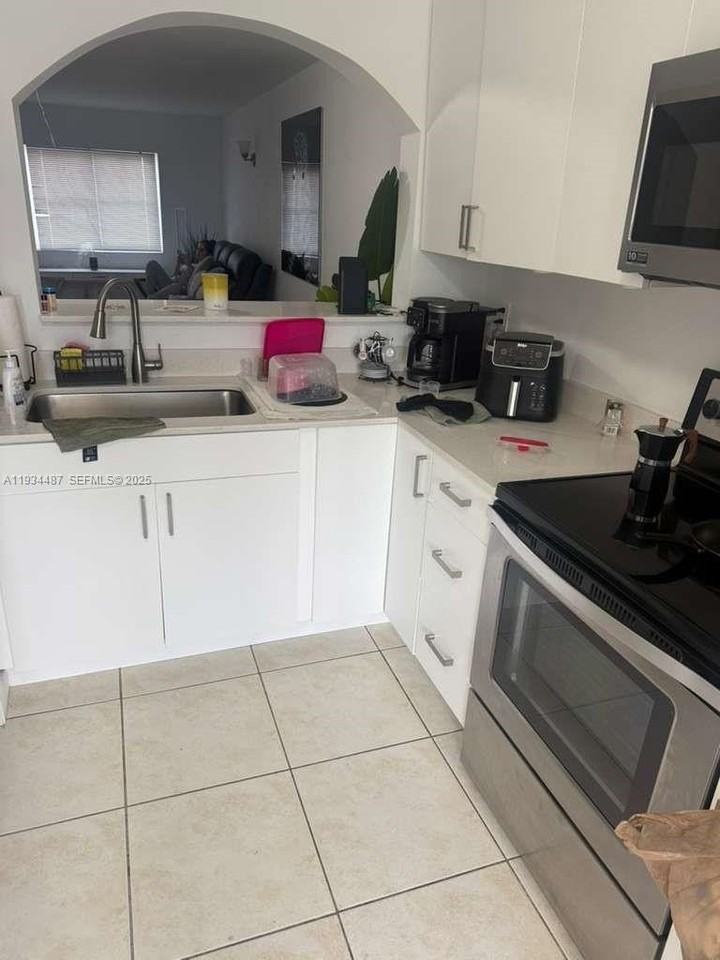 1250 Se 26th St #102 - Photo 3 of 7