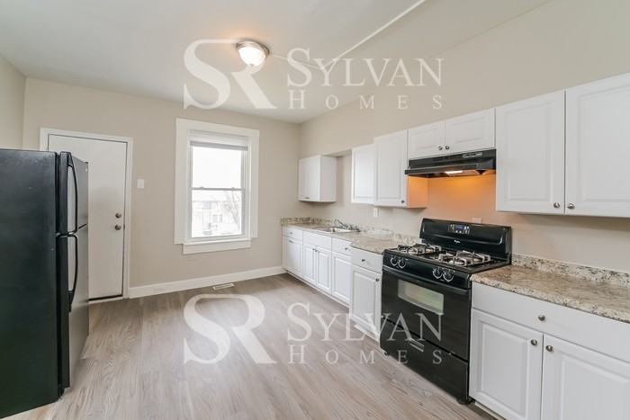 410 S Newkirk St - Photo 6 of 16