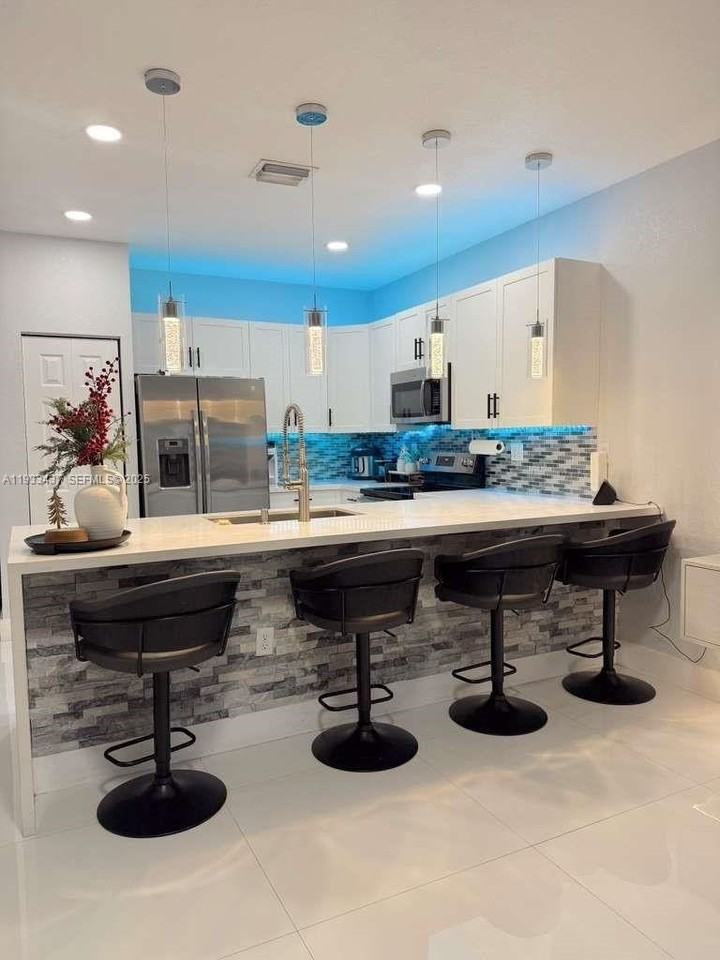 10598 W 33rd Ct - Photo 2 of 25