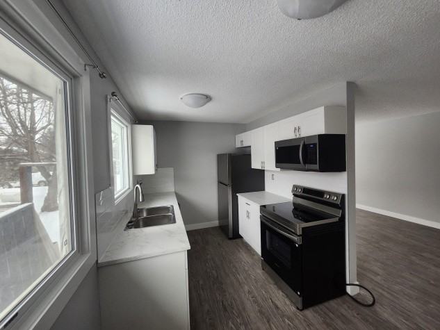 Newly Renovated Main Floor! Oversized Detached Garage Included! - Photo 2 of 9