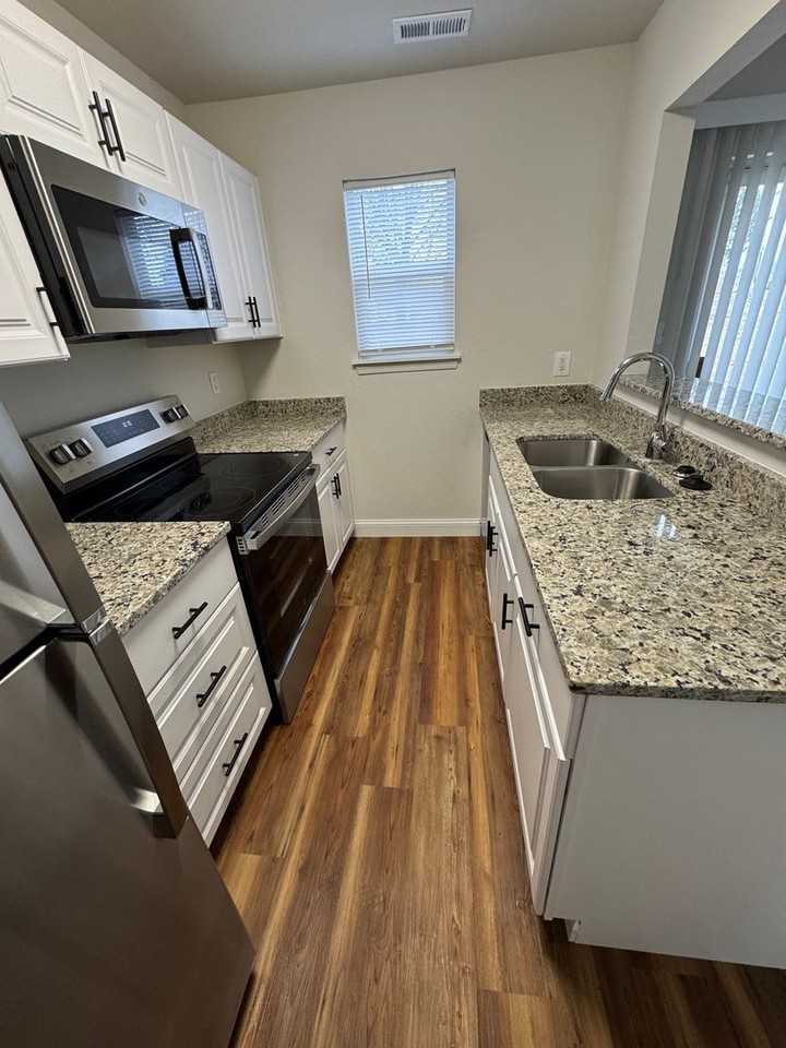 Summer Tree Townhomes, LLC - Photo 2 of 38