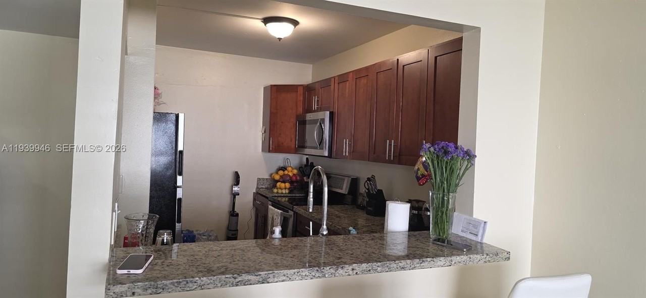 15304 Sunset Dr #28-14 - Photo 4 of 11