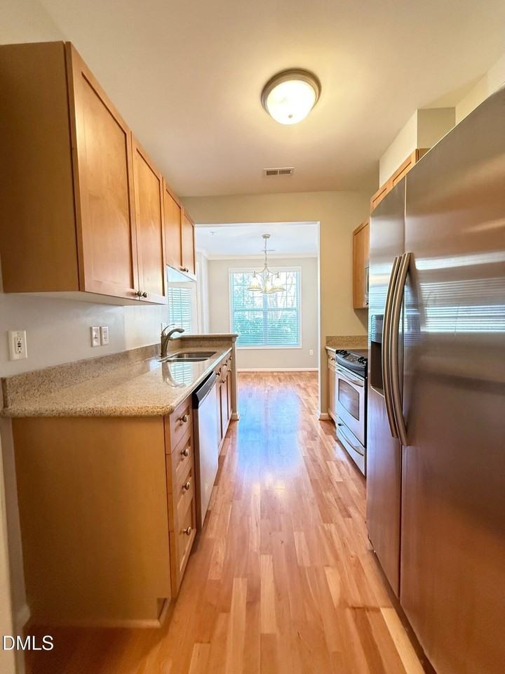 8021 Allyns Landing Way Apt 104 #104 - Photo 5 of 24