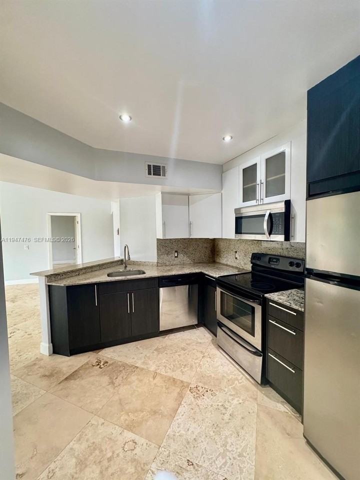 8871 Wiles Rd #306 - Photo 2 of 15