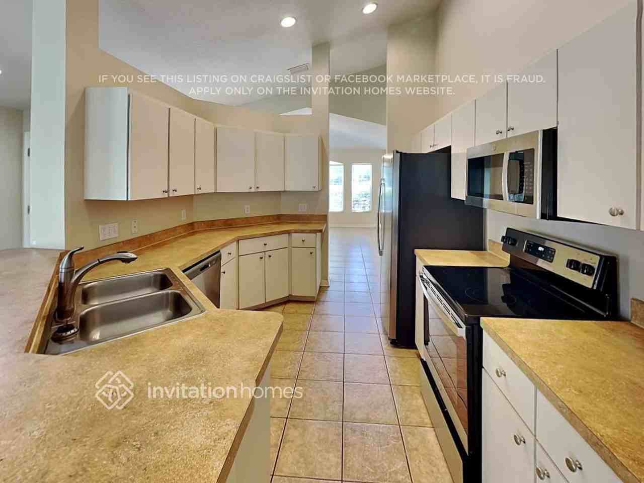 6923 34th Ave E - Photo 5 of 17