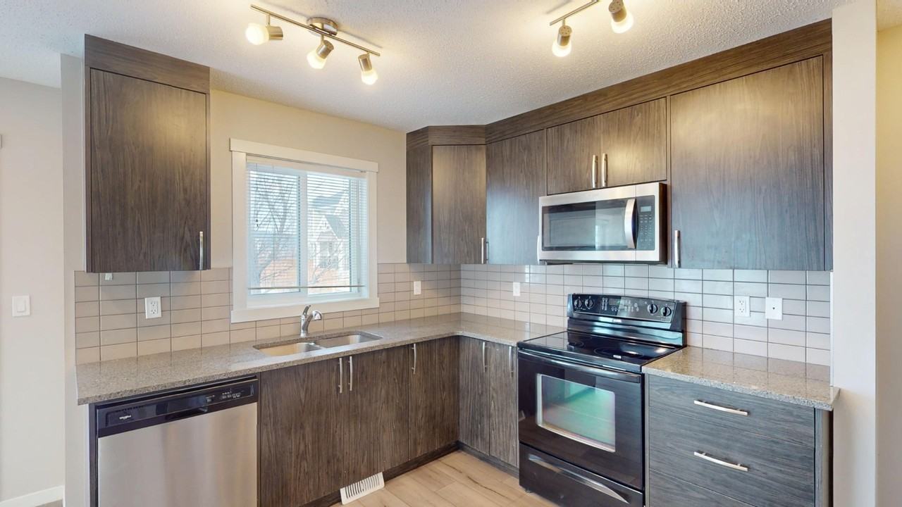 1004 - 7451 Falconridge Blvd NE - Photo 6 of 36