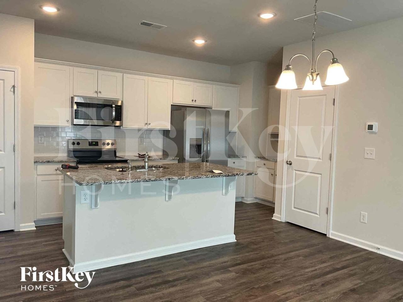 10743 Rivergate Dr Nw - Photo 3 of 9