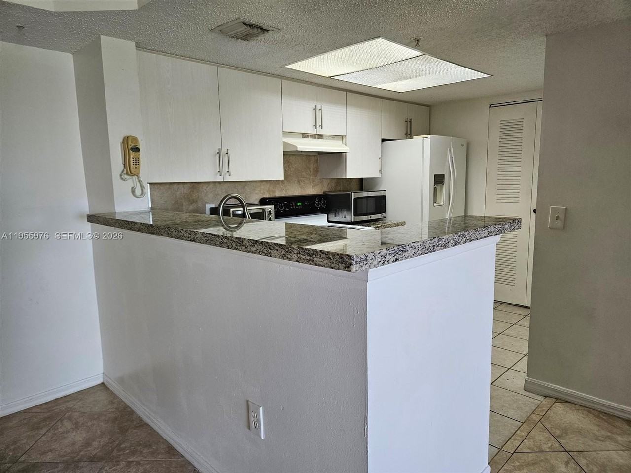 5011 Wiles Rd #306 - Photo 6 of 17