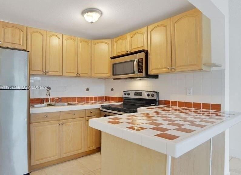 4275 Nw South Tamiami Canal Dr #2-310 - Photo 3 of 9