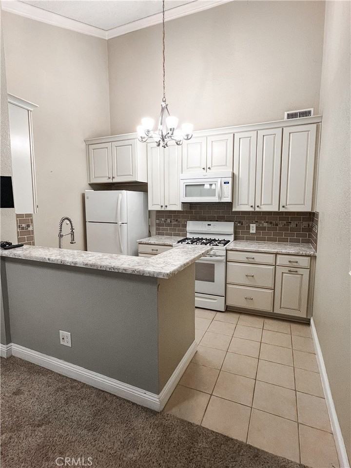 15240 Ocaso Ave #202 - Photo 5 of 11