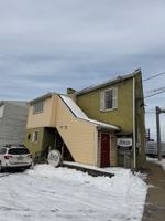 featured image of 100 W Main St