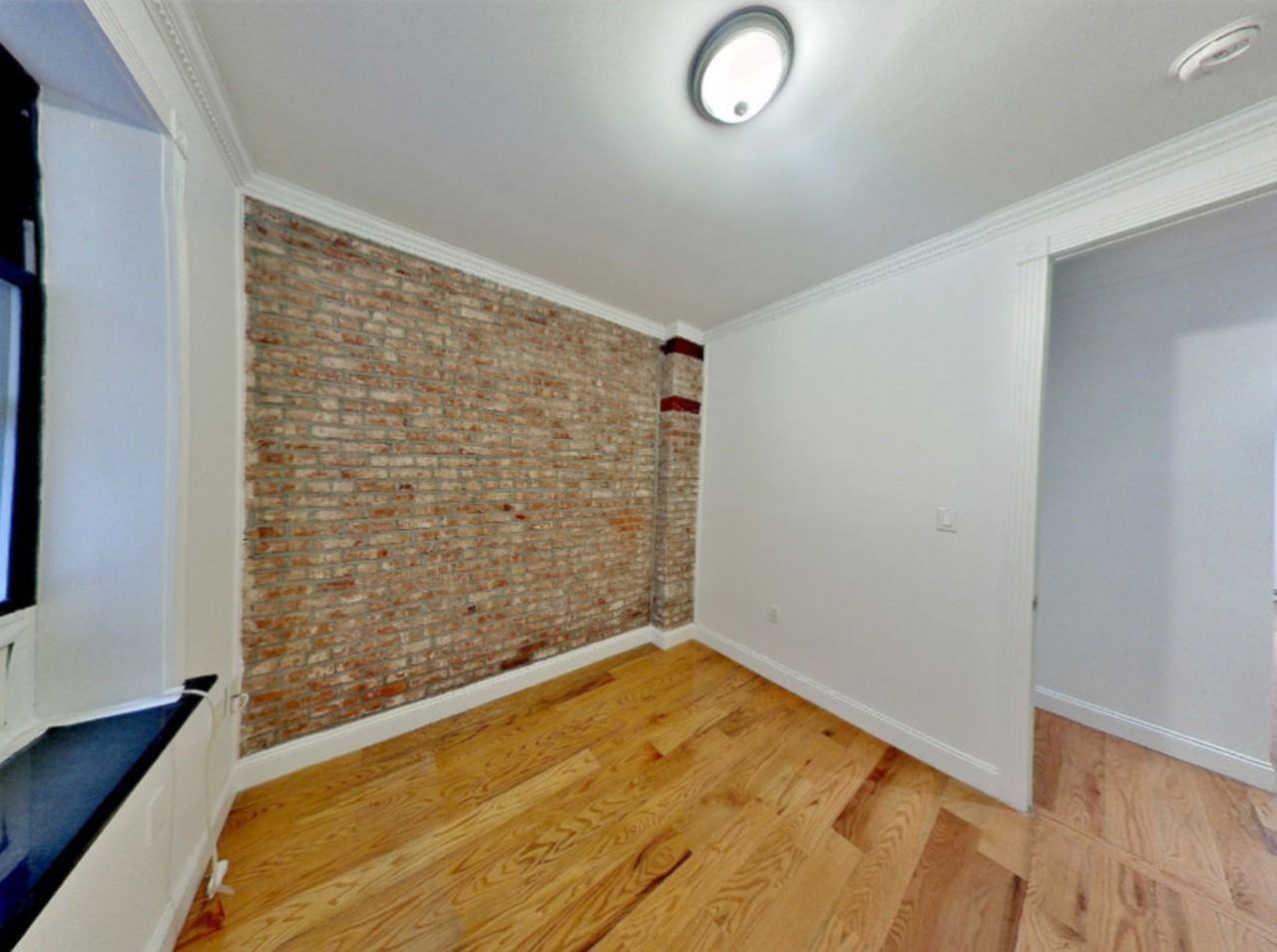 E 100th St - Photo 7 of 8