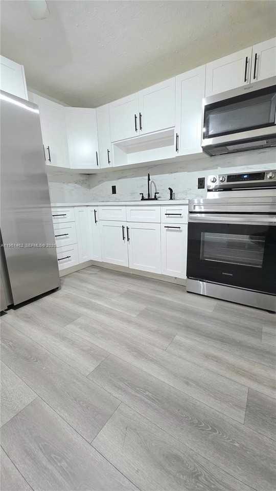 6616 Raleigh St #1 - Photo 3 of 37