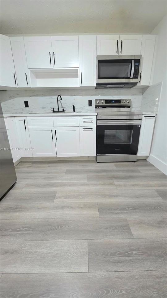 6616 Raleigh St #1 - Photo 5 of 37