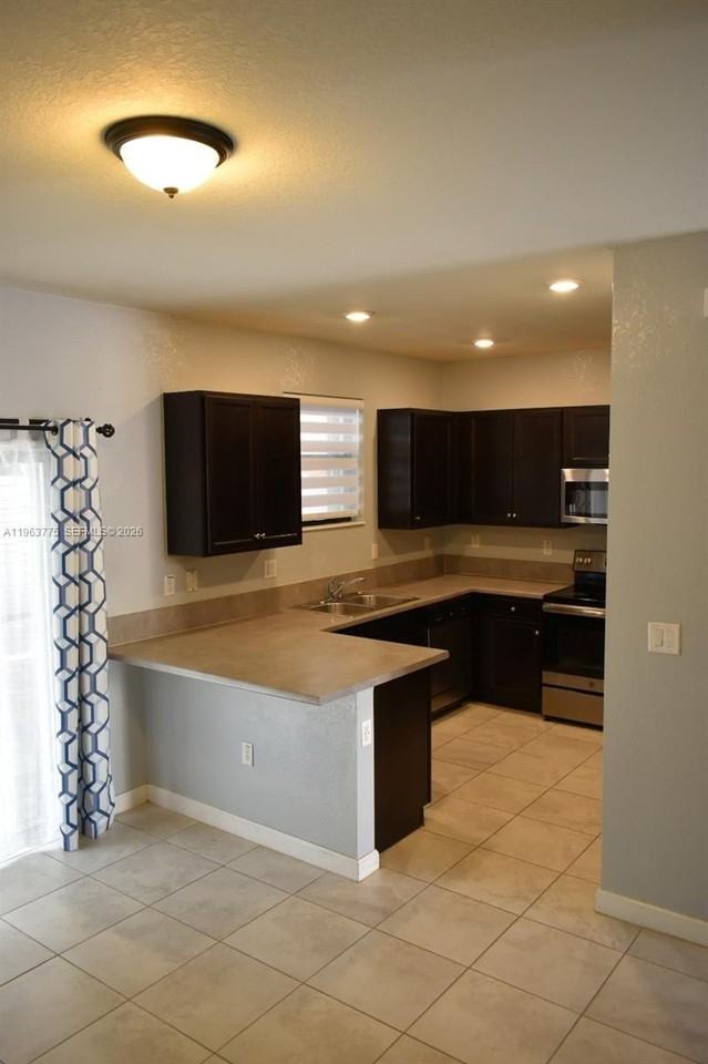 3392 Se 1st St - Photo 4 of 13