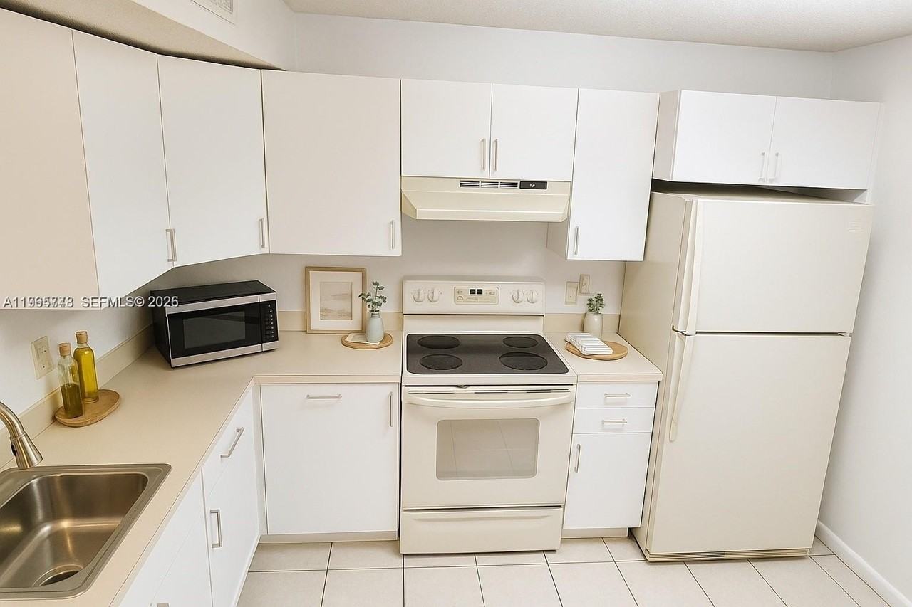 9001 Wiles Rd #103-3 - Photo 5 of 37