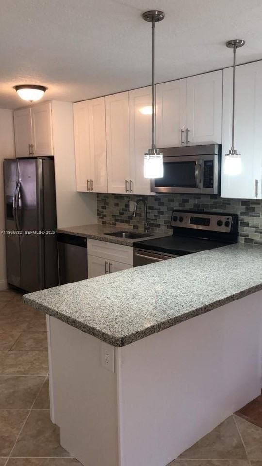 104 Gardens Dr #203 - Photo 2 of 13