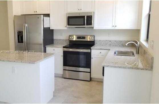 10603 W 34th Ct #10603 - Photo 3 of 7