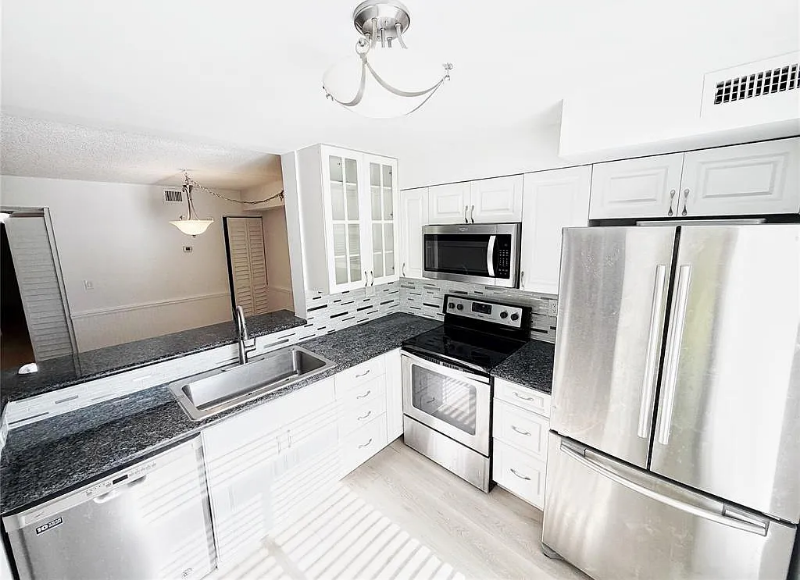 709 Gardens Dr #102 - Photo 3 of 20