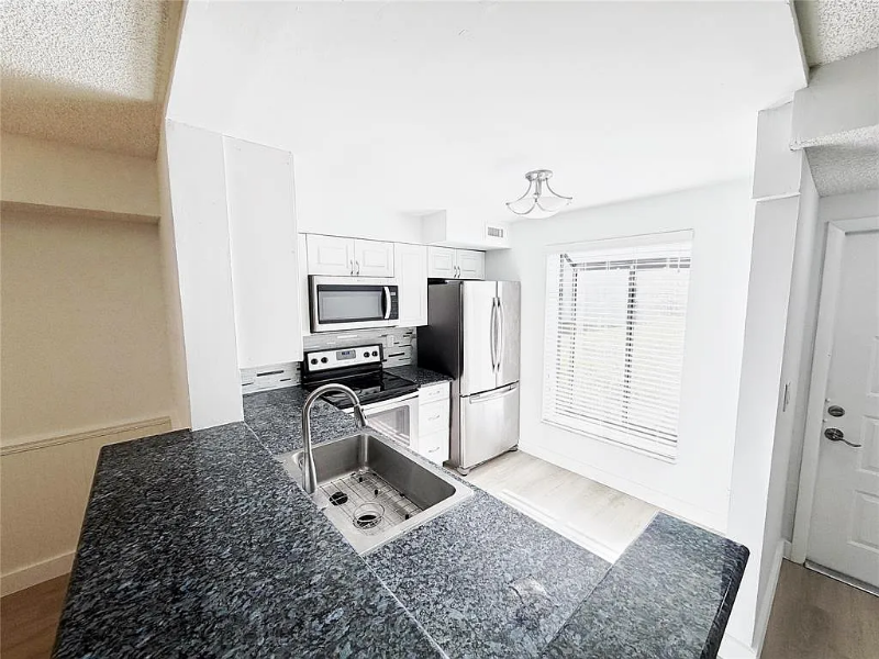 709 Gardens Dr #102 - Photo 6 of 20