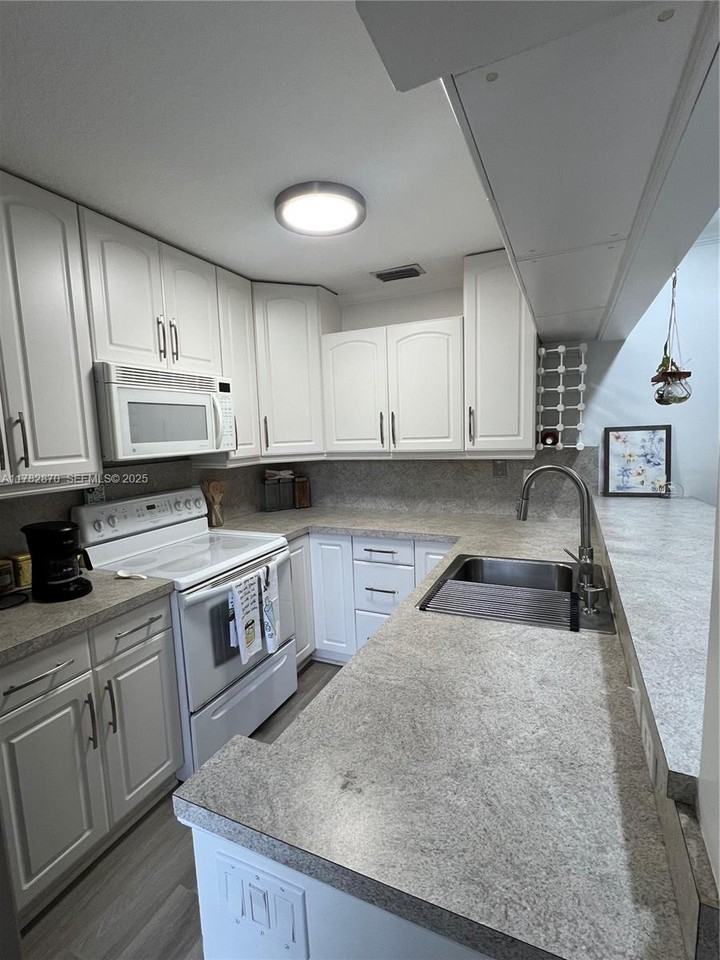 3357 Cocoplum Circle - Photo 3 of 52