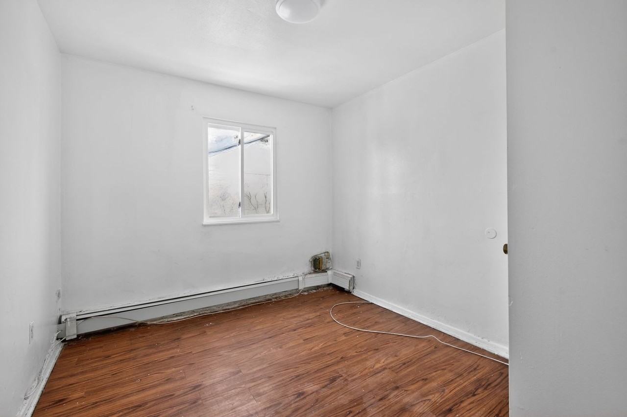 1102 E 233rd St - Photo 6 of 30