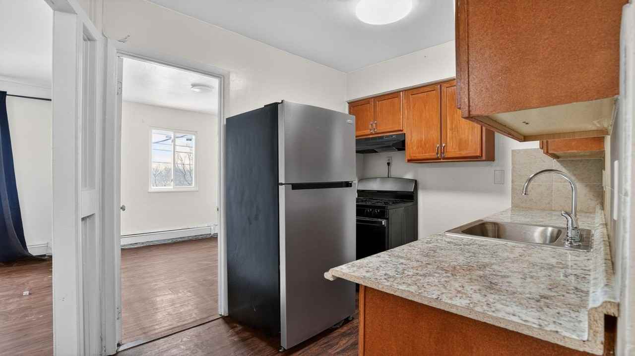 1102 E 233rd St - Photo 5 of 30