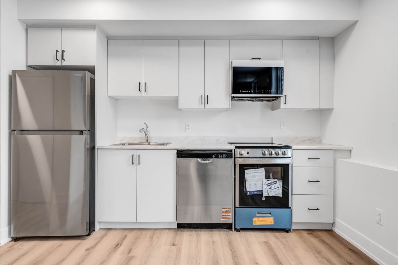 Modern kitchen with stainless appliances at 252 Hinchey