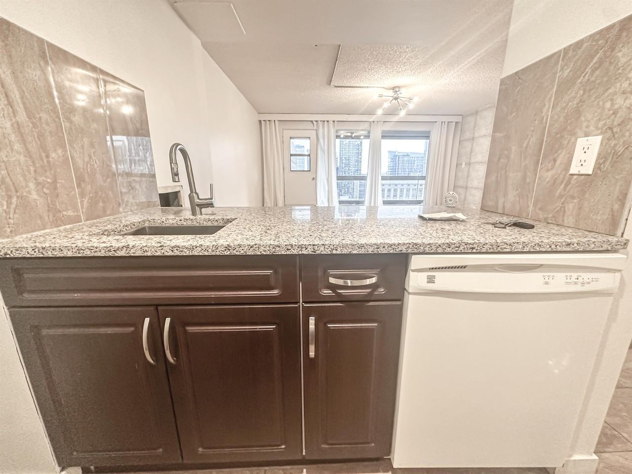 221 6 Avenue SE (Rocky Mountain Court) - Photo 4 of 17