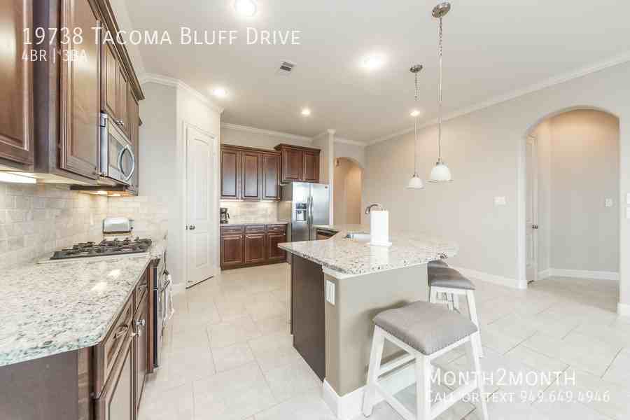 19738 Tacoma Bluff Dr - Photo 5 of 26