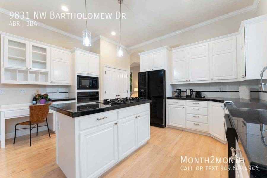 9831 Nw Bartholomew Dr - Photo 7 of 35