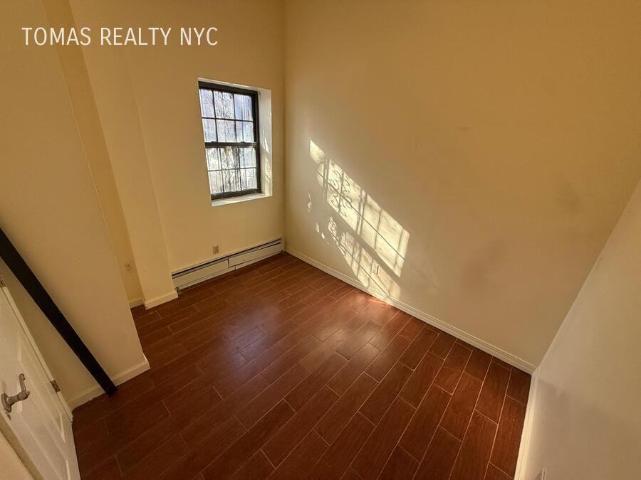 712 E 214th St - Photo 5 of 7