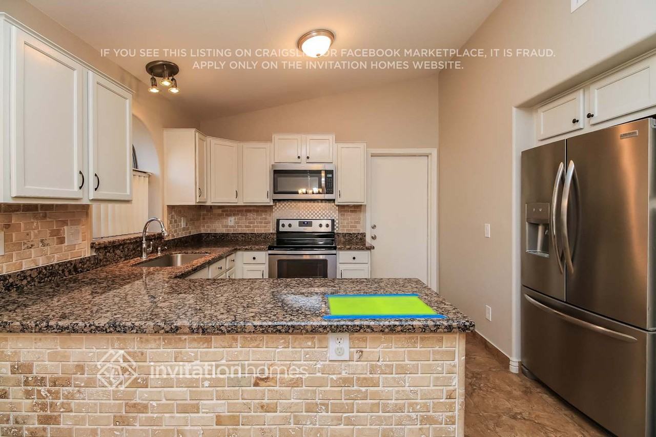 9827 E Olla Ave - Photo 6 of 16