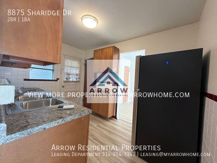 8875 Sharidge Dr - Photo 3 of 14