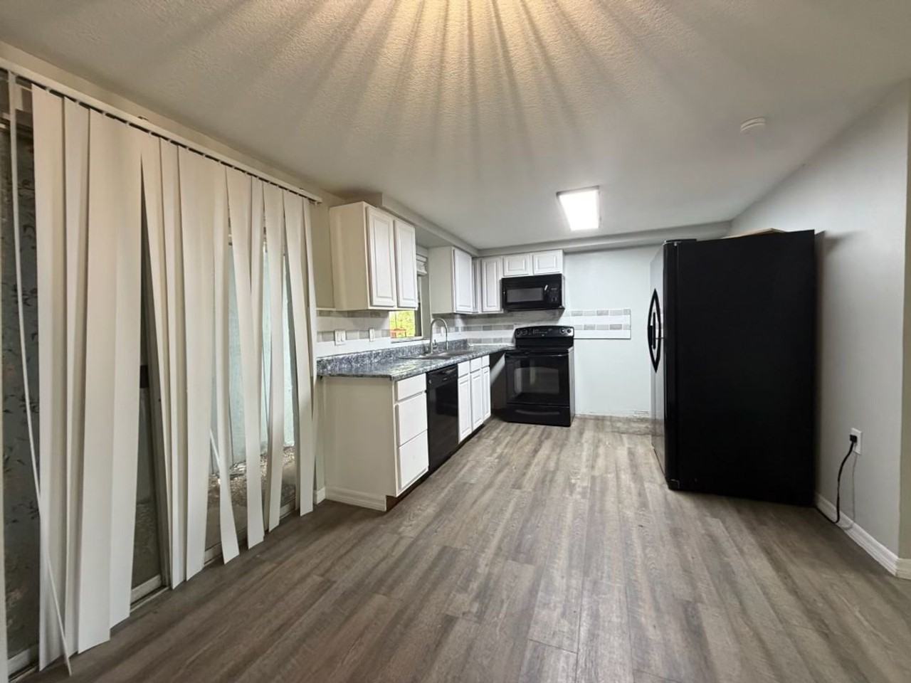 702 21st Ave W - Photo 4 of 15