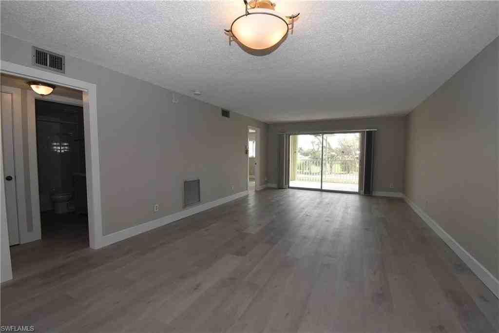 5667 Rattlesnake Hammock Rd Apt 205b - Photo 7 of 26