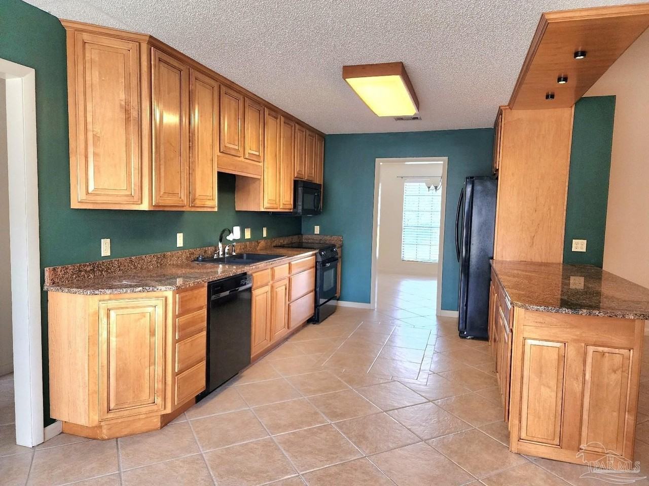 9001 Woodrun Rd - Photo 4 of 24