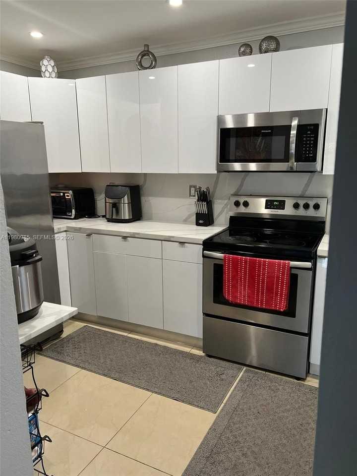 13715 Kendale Lakes Cir #A304 - Photo 3 of 34