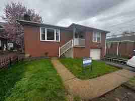 featured image of 119 E 3rd St