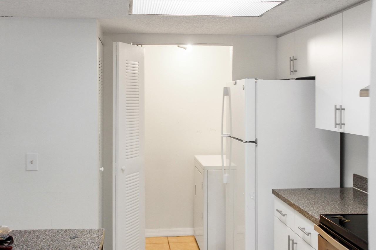 5065 Wiles Rd Apt 307 - Photo 2 of 35