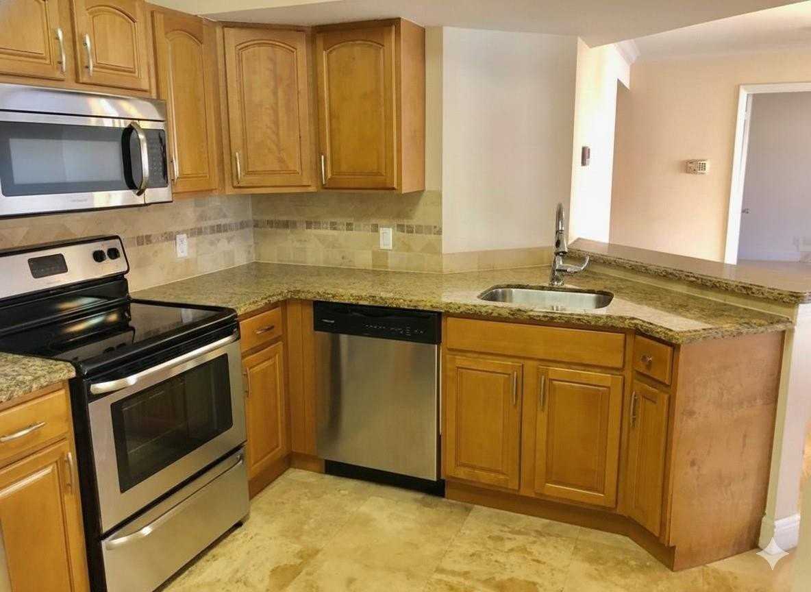 8721 Wiles Rd Apt 104 - Photo 3 of 30