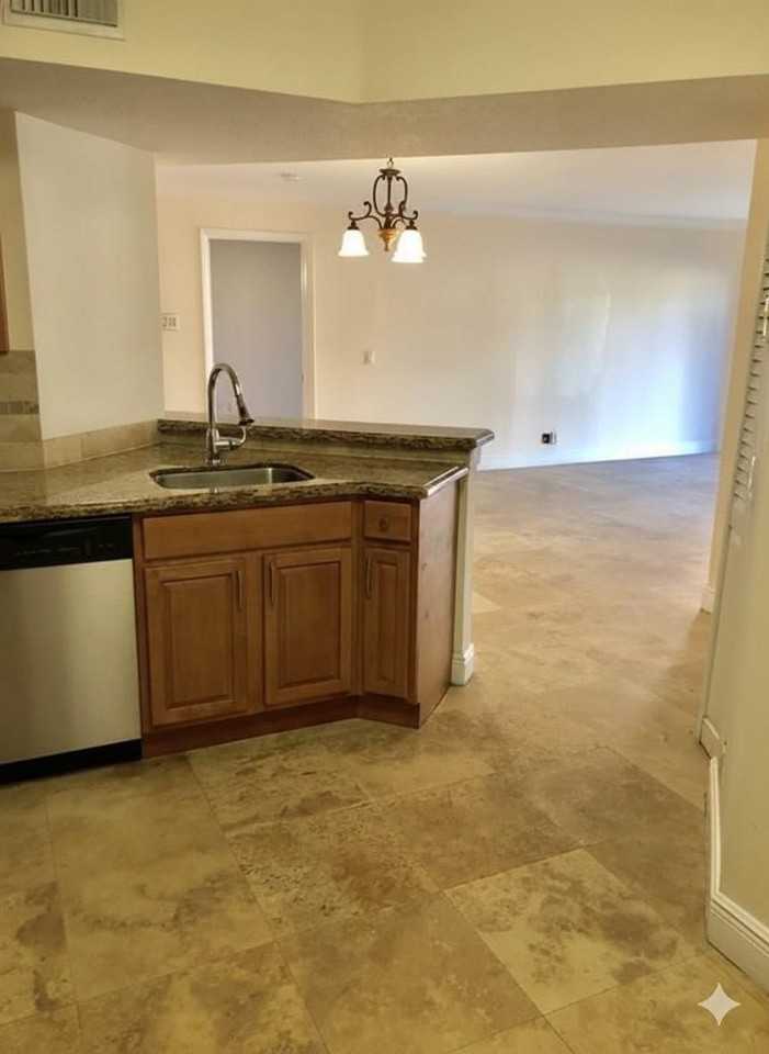 8721 Wiles Rd Apt 104 - Photo 4 of 30