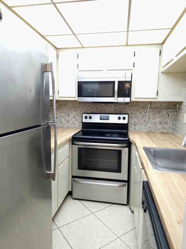 10031 Winding Lake Rd #104 - Photo 5 of 26