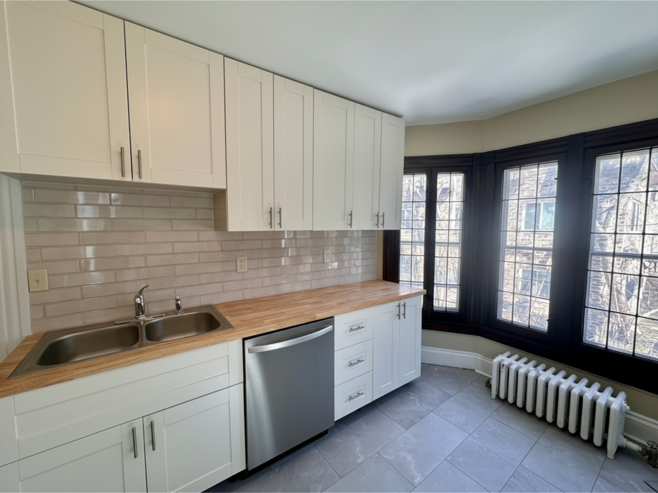 Updated 4BR/2BA in the Water Tower District $3200 – Spacious, Sunny & Steps from Lake Drive - Photo 5 of 17