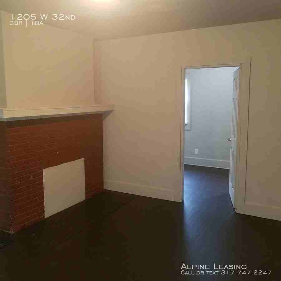 1205 W 32nd St - Photo 5 of 7