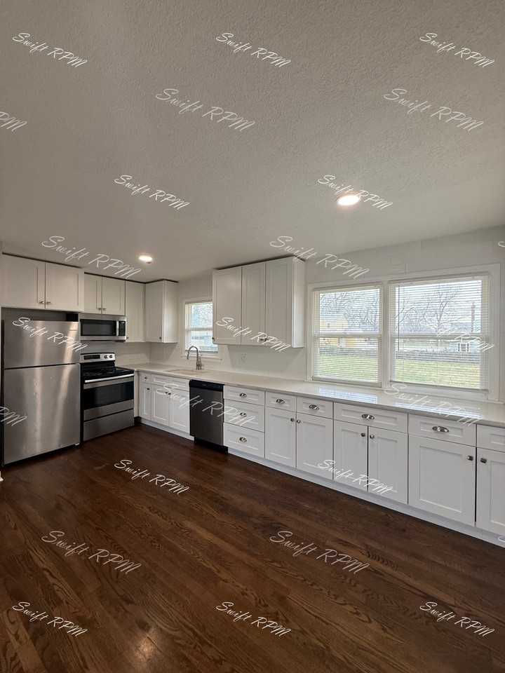 1827 E 75th Ter #1 - Photo 4 of 18