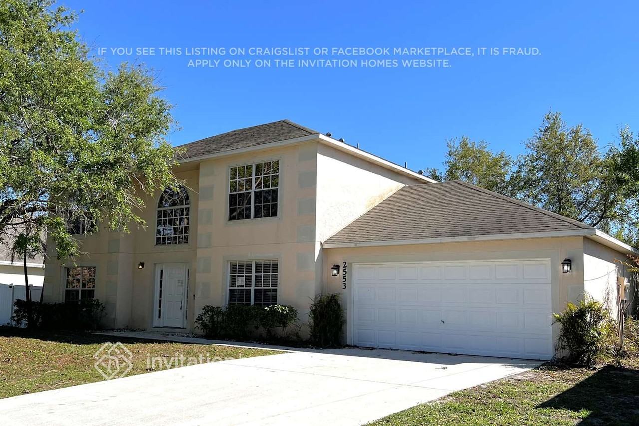 2553 Sw Grotto Cir - Photo 2 of 19