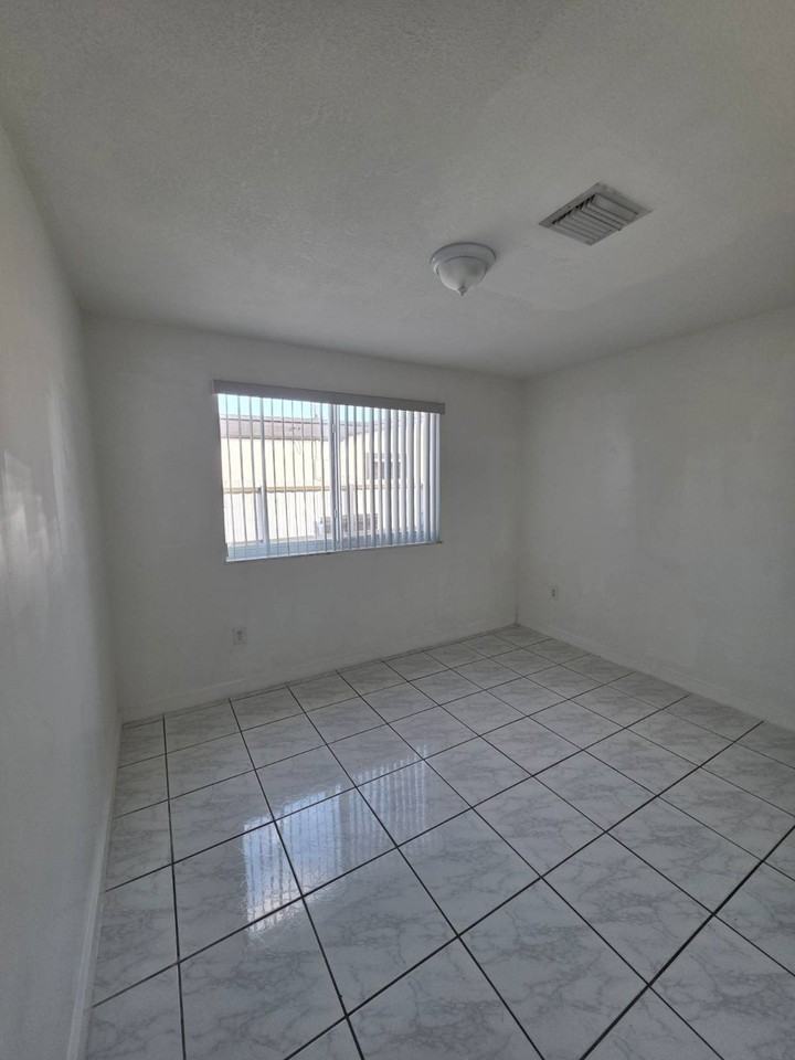 1475 W 31st St #2 - Photo 6 of 9