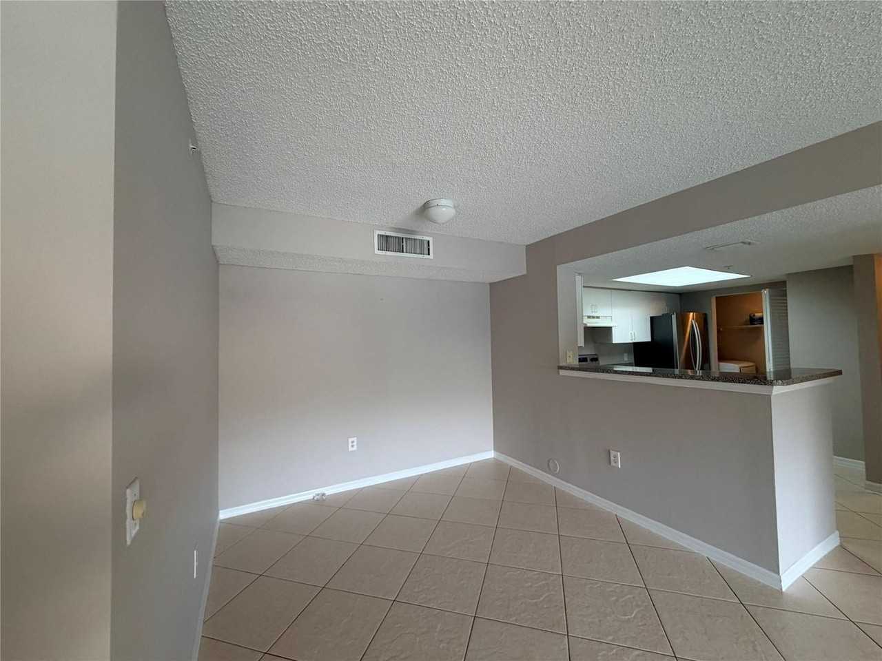 5025 Wiles Rd - Photo 3 of 16